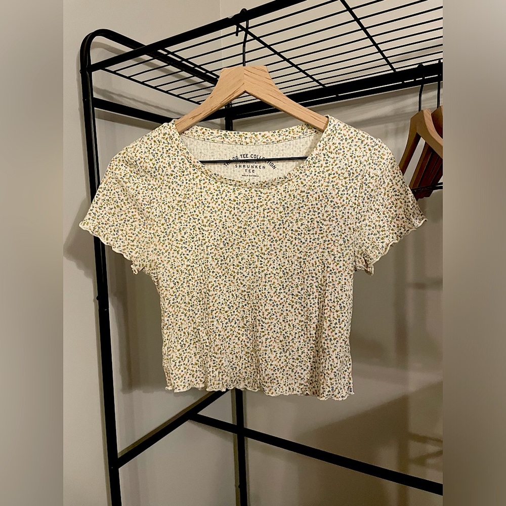 Tan baby tee with flower pattern